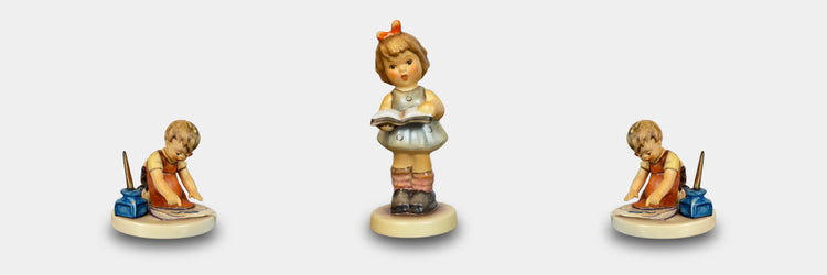 hummelfigurine maria who is reading and her two brother writing